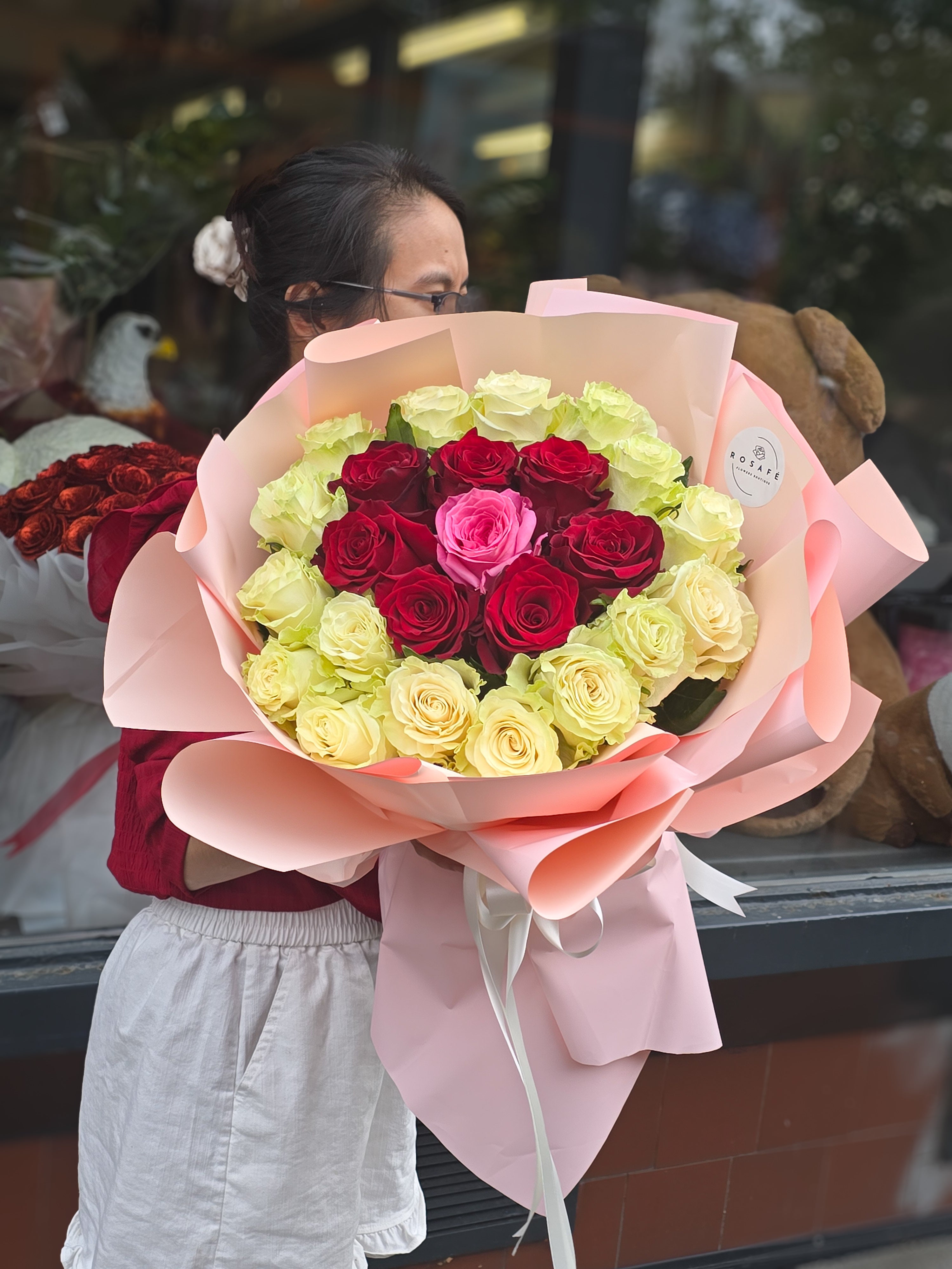 Romantic bouquet of roses in the colors of love