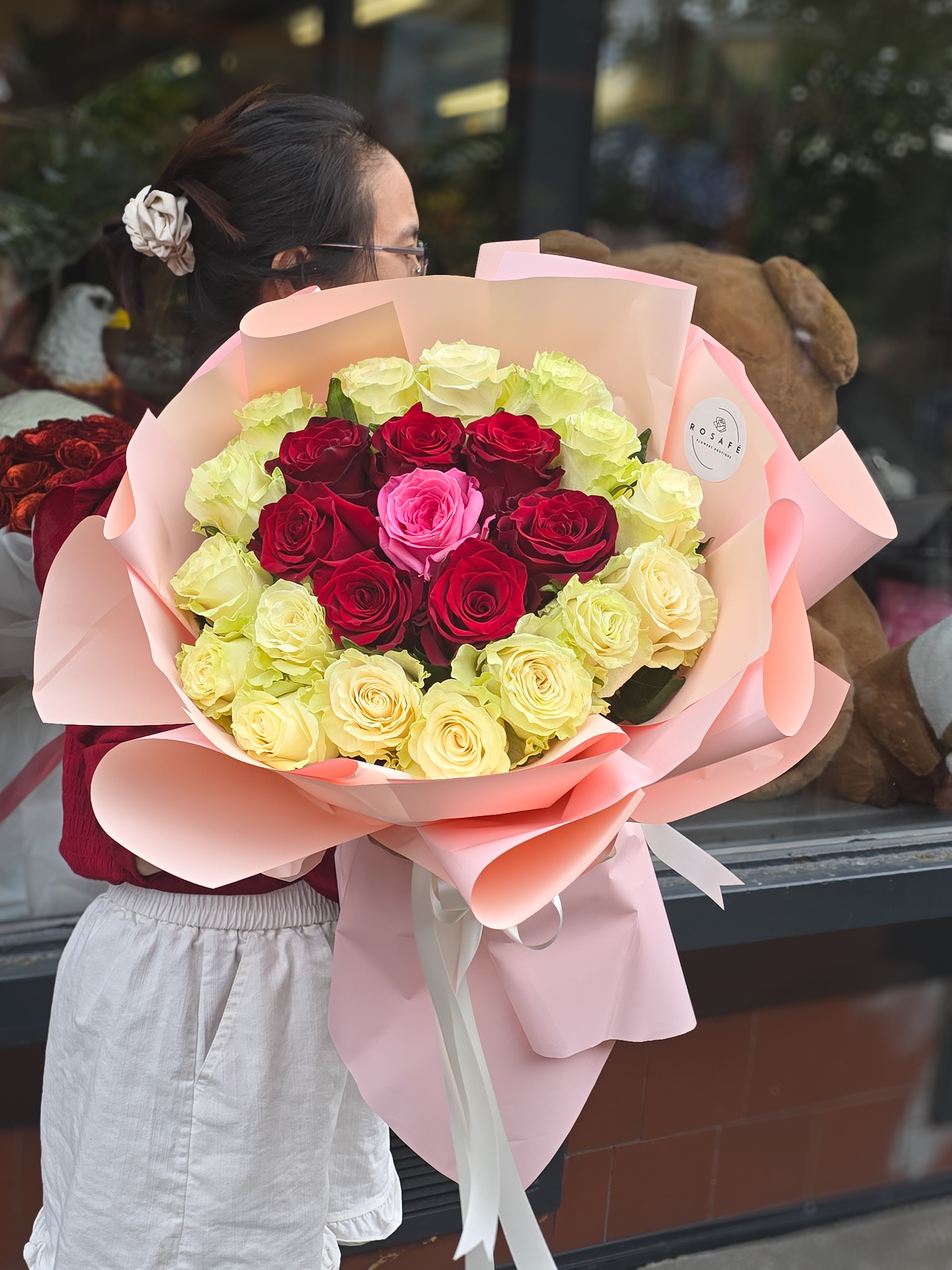 Romantic bouquet of roses in the colors of love