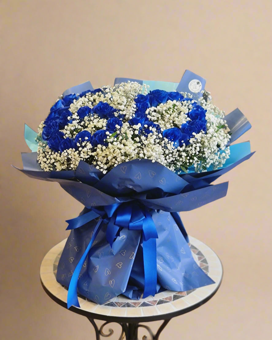 Bouquet of blue roses and gypsophila for a 60th birthday