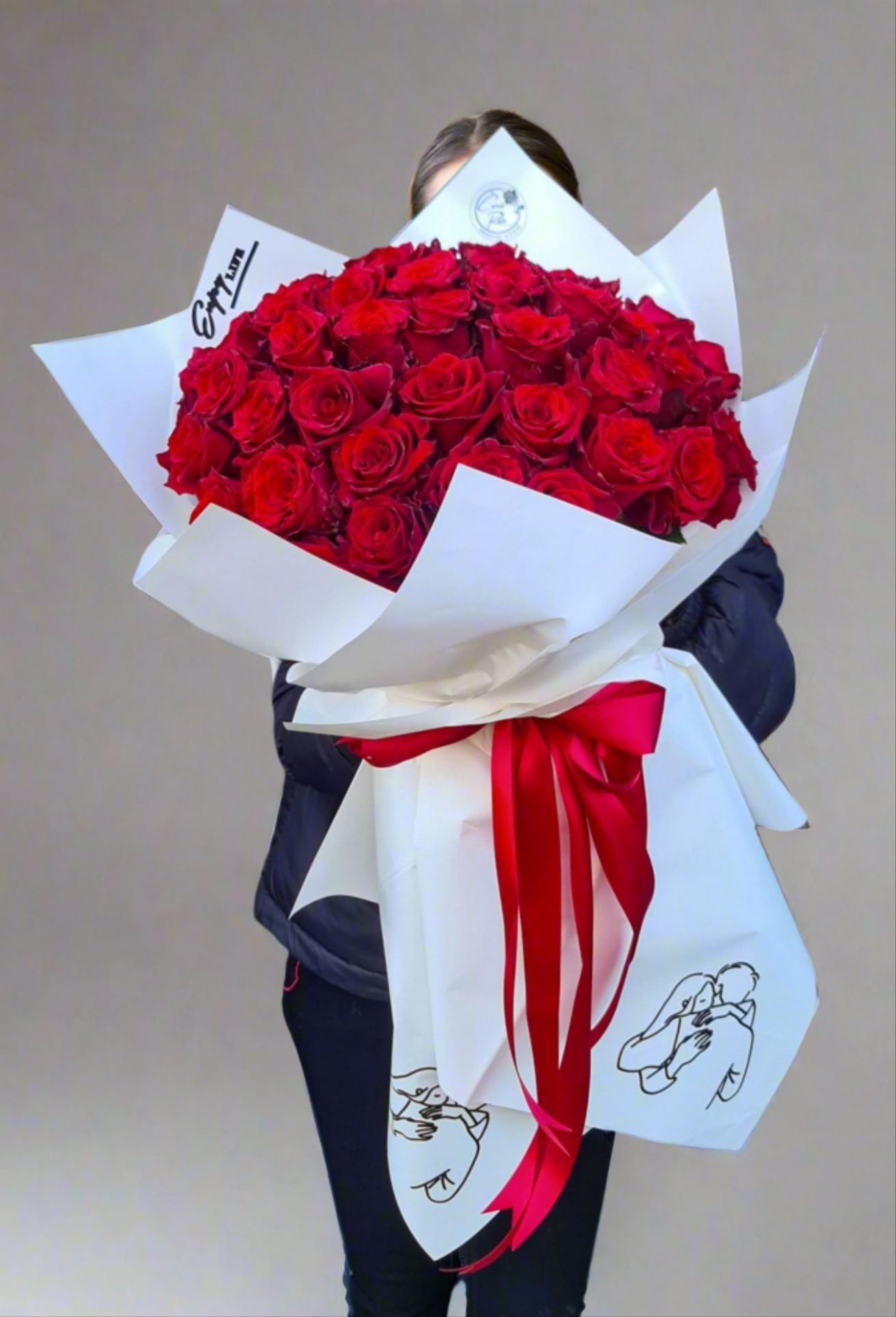 Bouquet of red roses with gypsophila