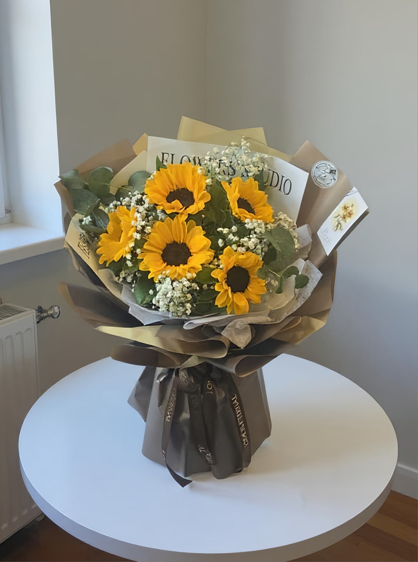 Summer bouquet with sunflowers and gypsophila