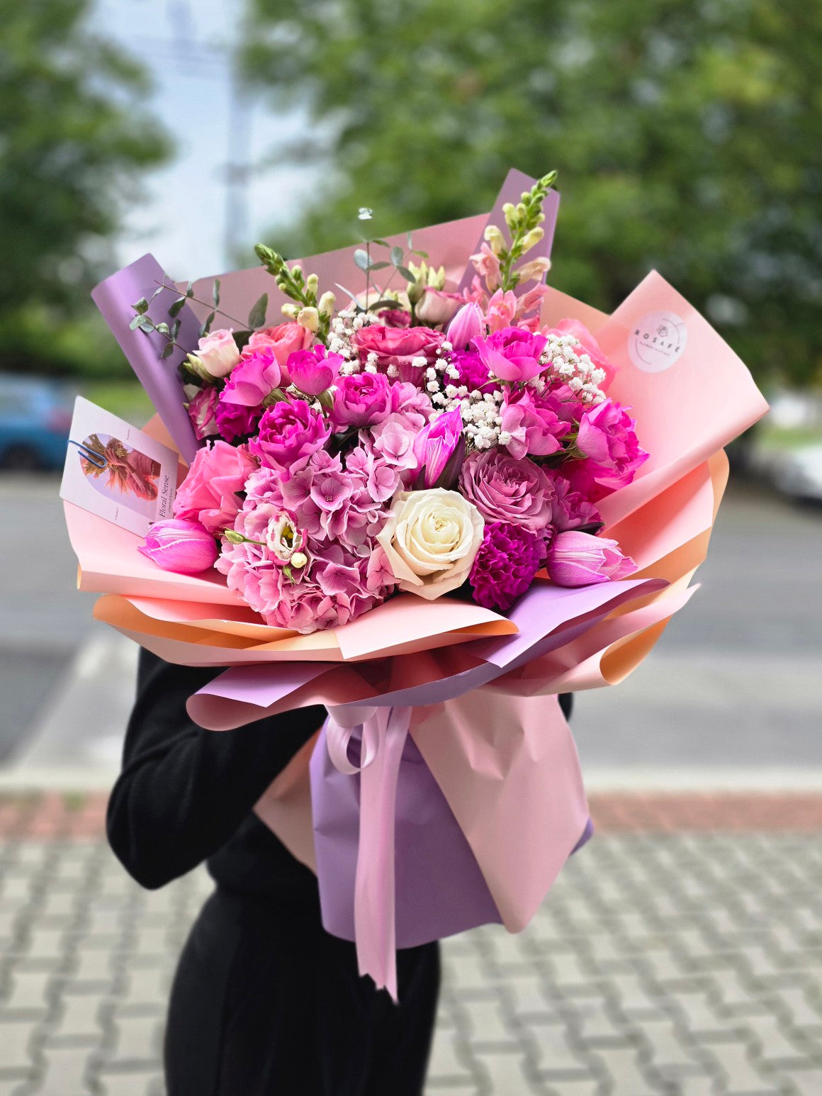 Bouquet of roses and tulips in pink and purple tones - a gift of love