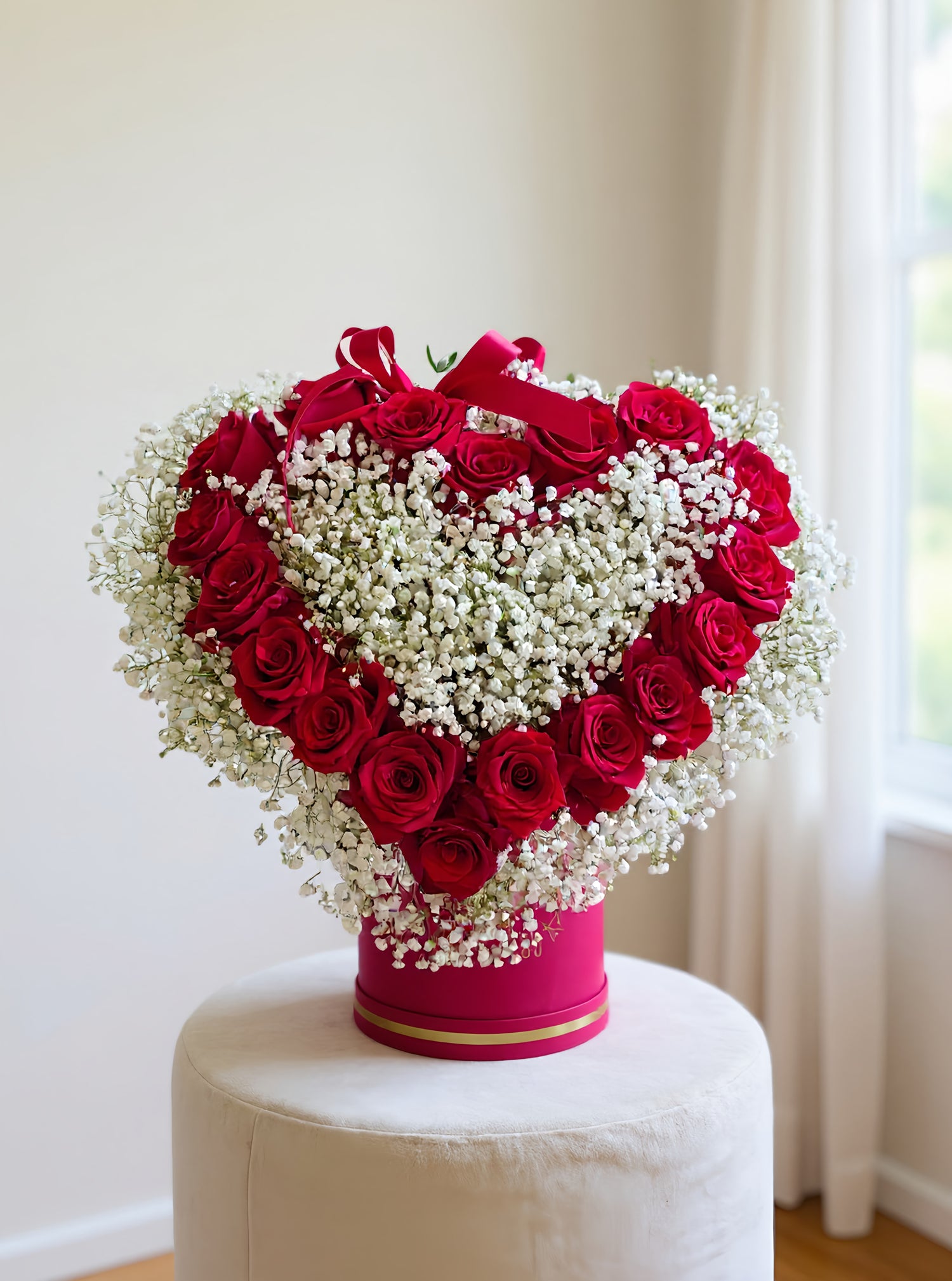 Luxurious heart box with 18 red roses and white gypsophila